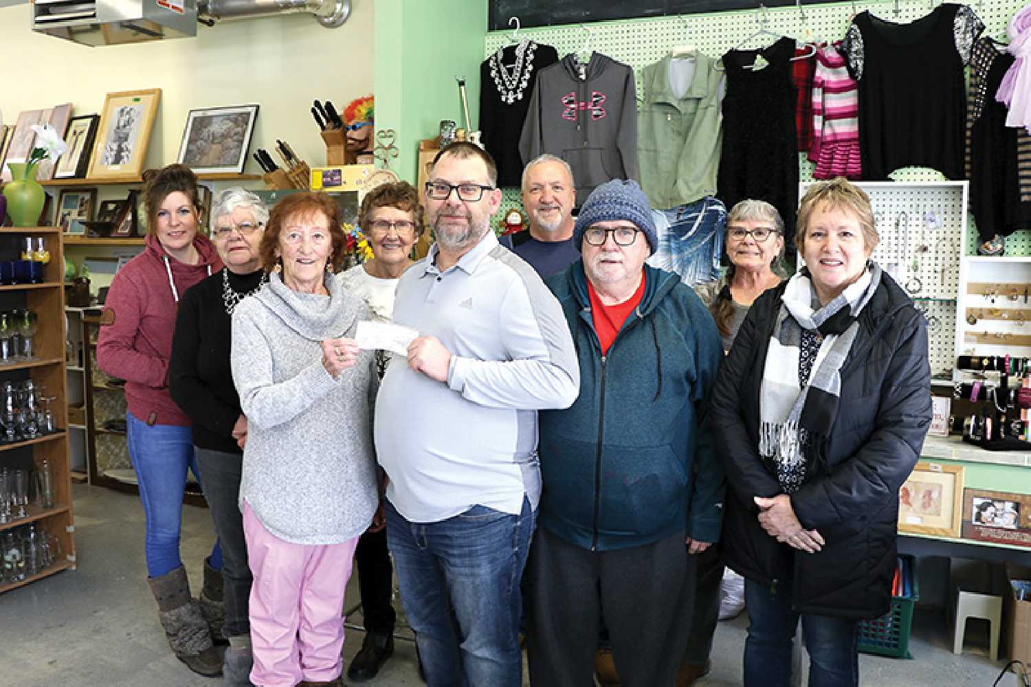 Last Tuesday, the Rocanville Thrift Store donated $10,000 to the Moosomin and District Health Care Foundation in support of funding a CT Scanner for the hospital. <b>From left are,</b> volunteers of the thrift store Kim Wahoski, Joyce Surridge, Linda Bock, Marjorie Thompson, Mayor of Rocanville and member of Moosomin and District Health Care Foundation Ron Reed, volunteers for the thrift store Willie Restau, Paul Bunz, and Alma Ducharme, and Wendy Lynd of the Moosomin and District Health Care Foundation.